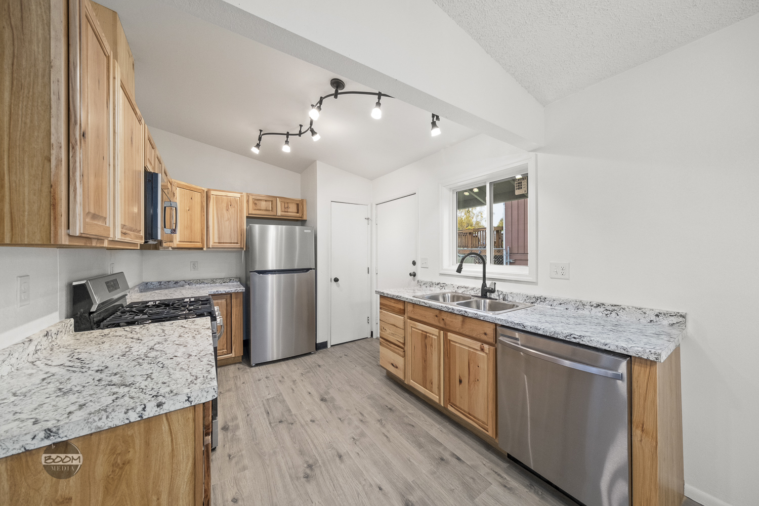 New kitchen with hickory cabinets, granite counters and stainless appliances